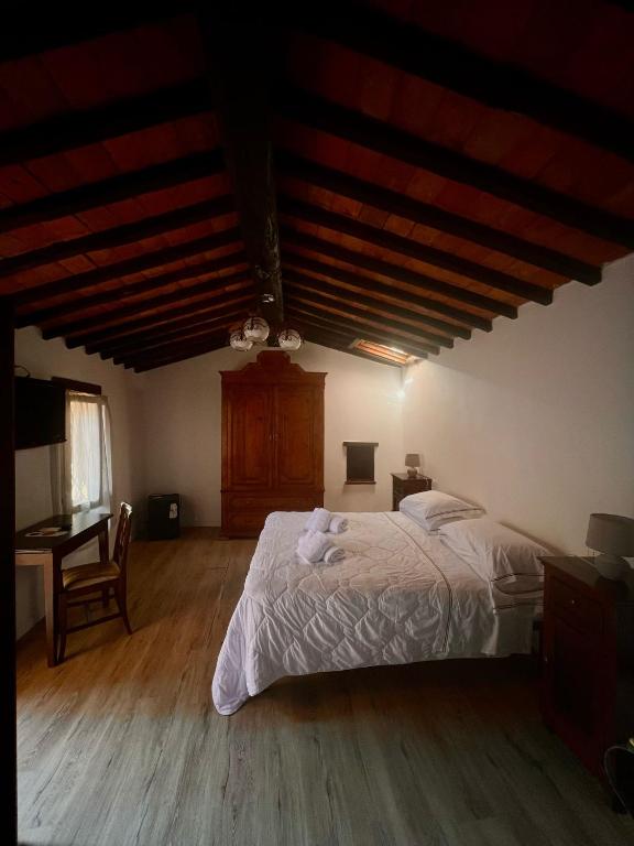 Postel nebo postele na pokoji v ubytování Hotel Il Pietreto