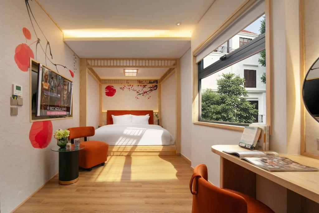 Postel nebo postele na pokoji v ubytování Aurora Oriental Hotel