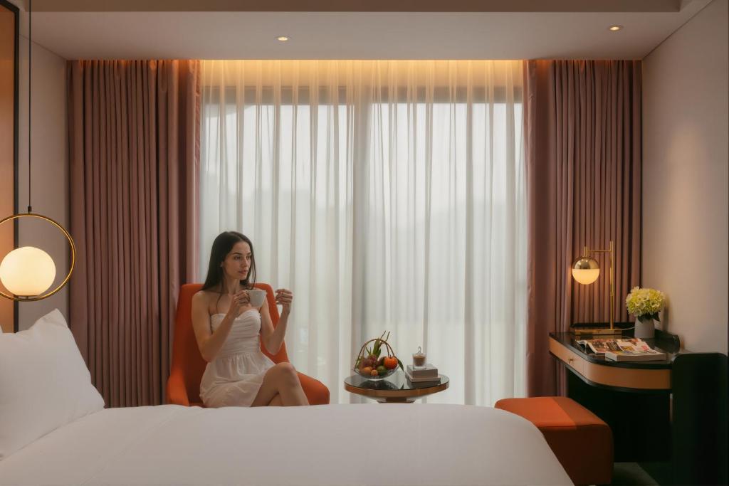 Postel nebo postele na pokoji v ubytování Aurora Oriental Hotel