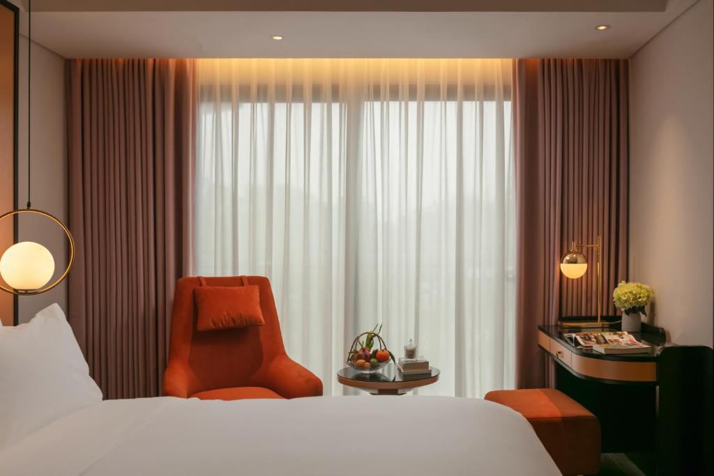 Postel nebo postele na pokoji v ubytování Aurora Oriental Hotel