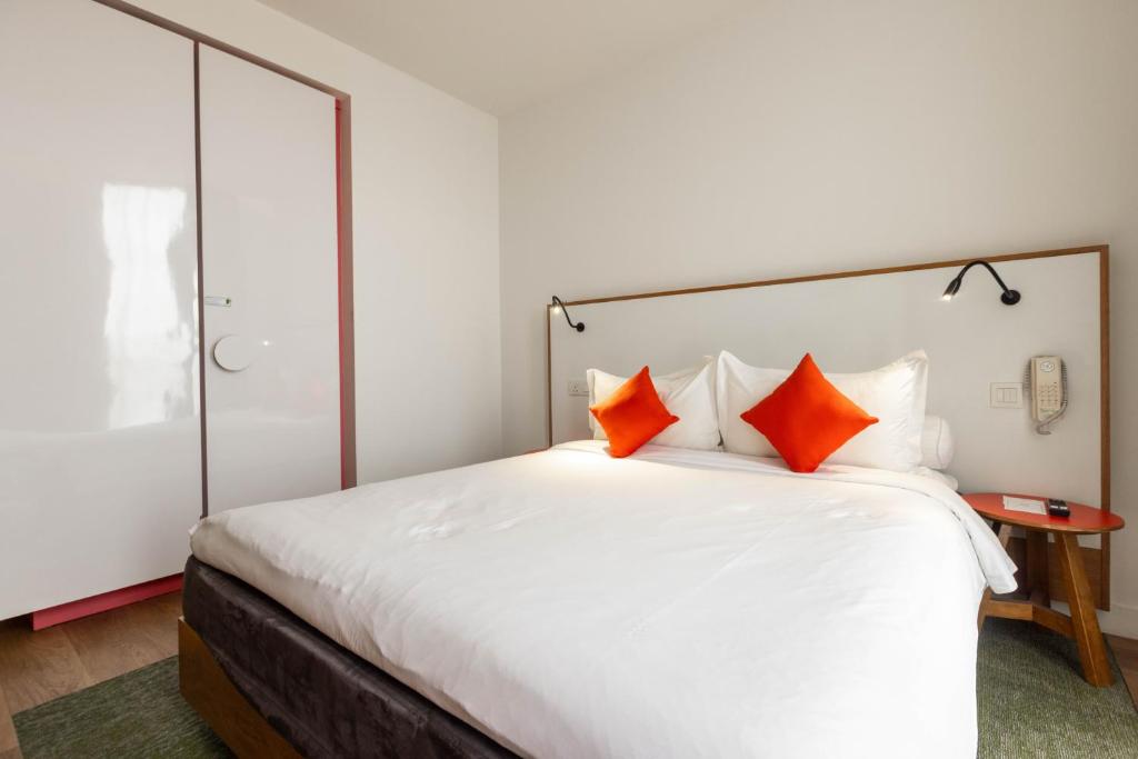 Postel nebo postele na pokoji v ubytování MU Hotel