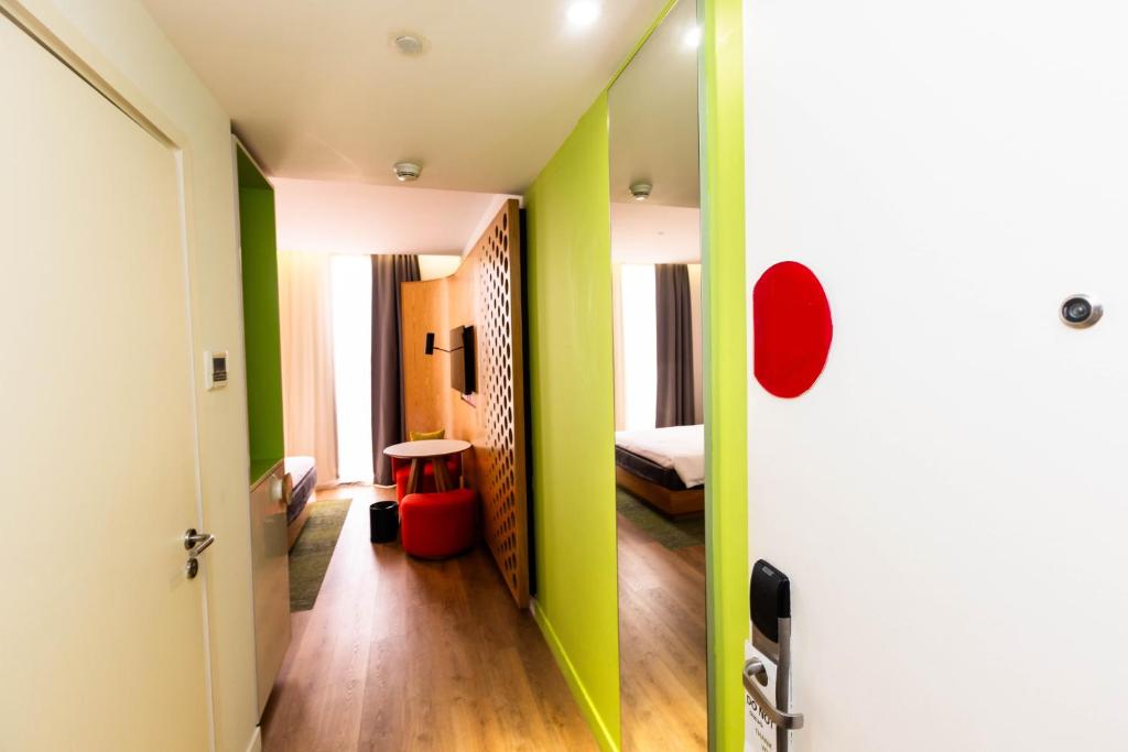 Postel nebo postele na pokoji v ubytování MU Hotel