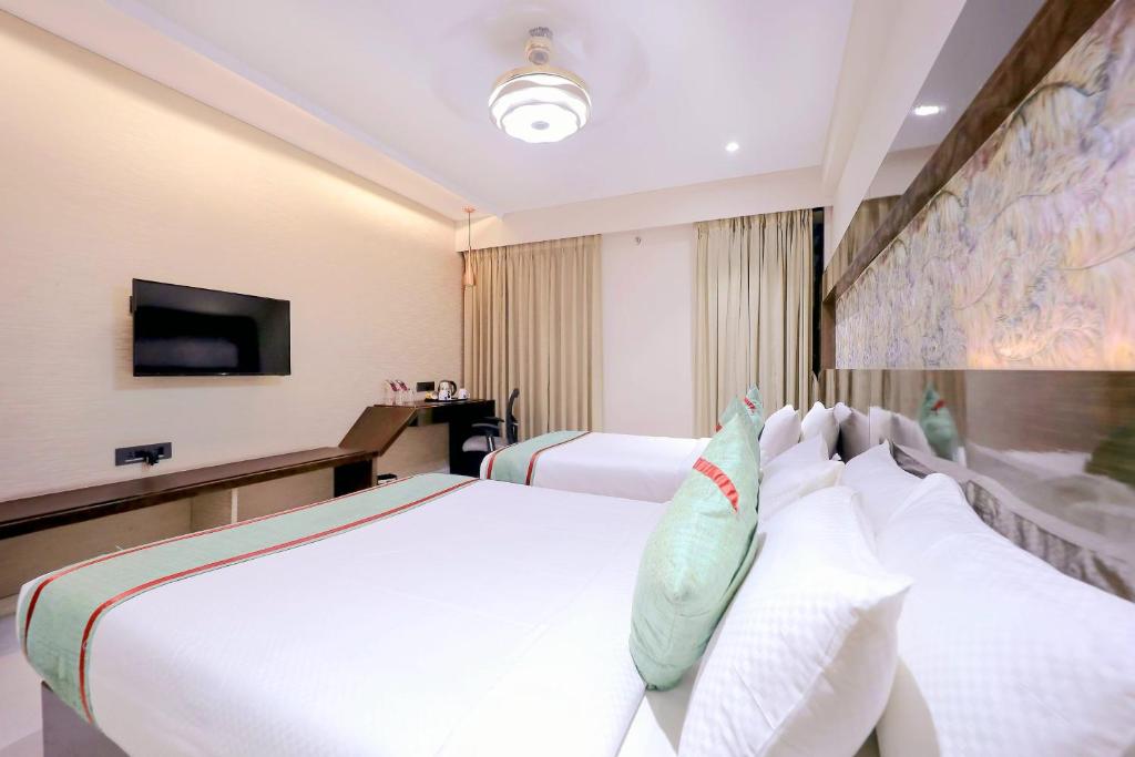Postel nebo postele na pokoji v ubytování Hotel Ramida Plaza At Delhi Airport
