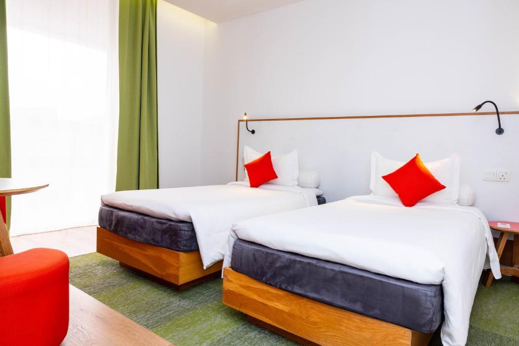 Postel nebo postele na pokoji v ubytování MU Hotel