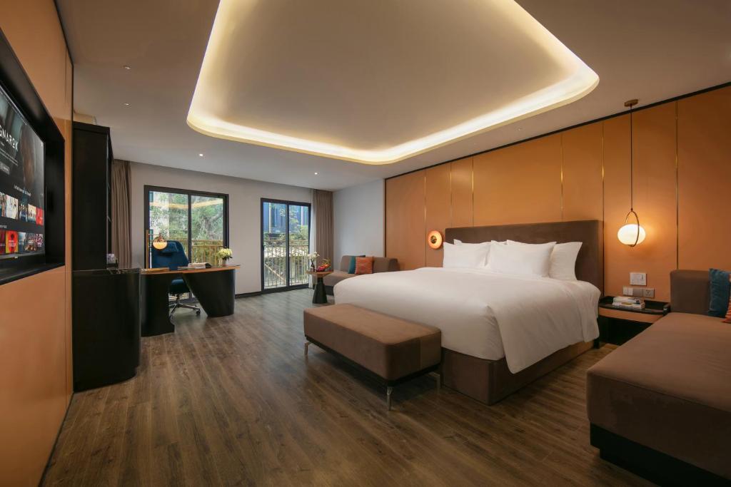 Postel nebo postele na pokoji v ubytování Aurora Oriental Hotel