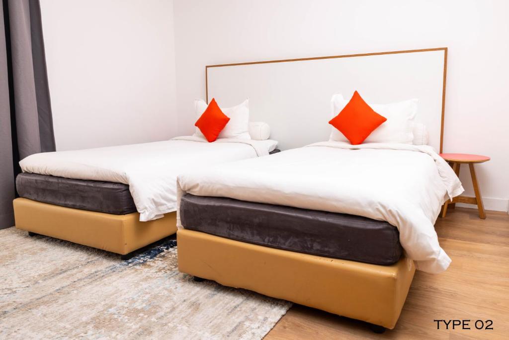 Postel nebo postele na pokoji v ubytování MU Hotel