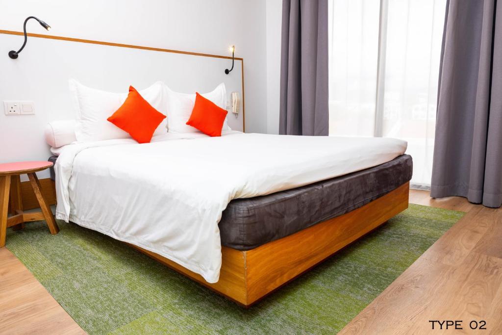 Postel nebo postele na pokoji v ubytování MU Hotel