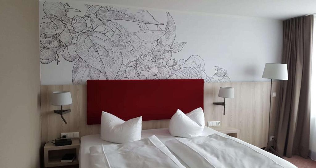 Postel nebo postele na pokoji v ubytování Best Western Erfurt-Apfelstädt