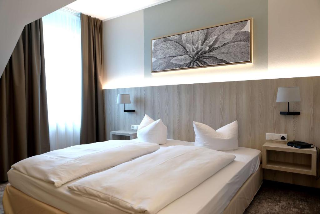Postel nebo postele na pokoji v ubytování Best Western Erfurt-Apfelstädt