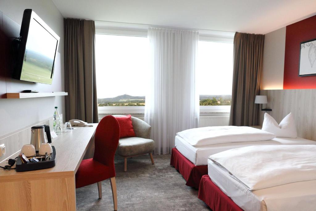 Postel nebo postele na pokoji v ubytování Best Western Erfurt-Apfelstädt