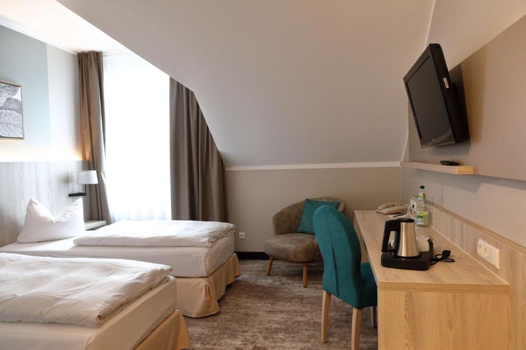 Postel nebo postele na pokoji v ubytování Best Western Erfurt-Apfelstädt