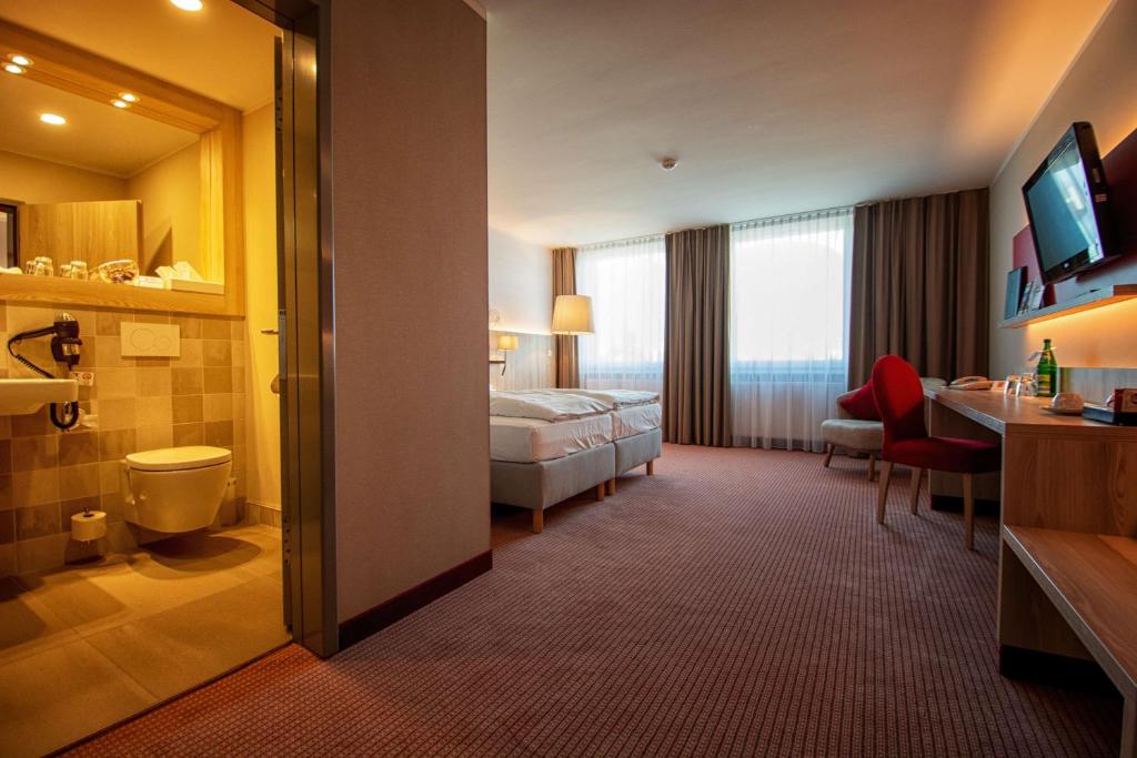 Postel nebo postele na pokoji v ubytování Best Western Erfurt-Apfelstädt