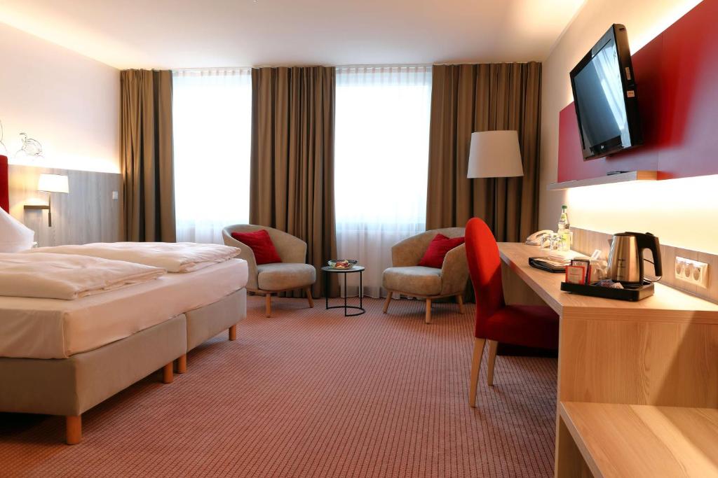 Postel nebo postele na pokoji v ubytování Best Western Erfurt-Apfelstädt