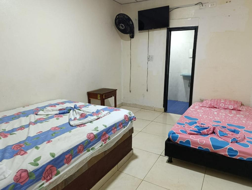 Postel nebo postele na pokoji v ubytování hotel villa palmera campestre