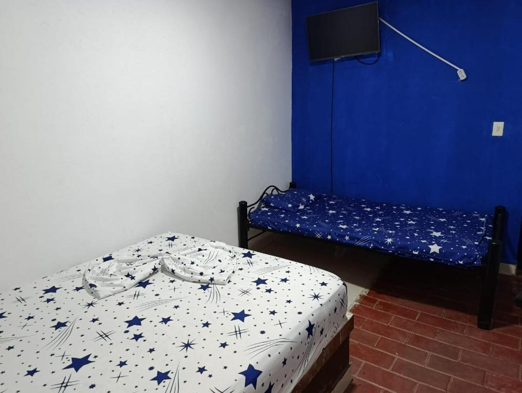 Postel nebo postele na pokoji v ubytování hotel villa palmera campestre