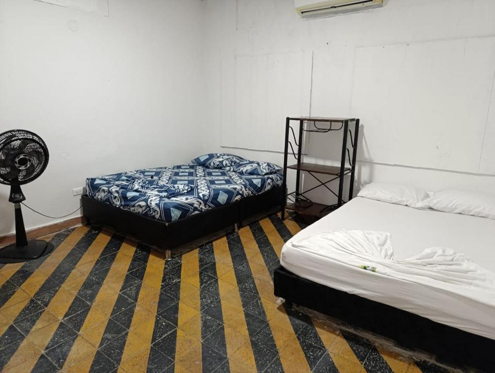 Postel nebo postele na pokoji v ubytování hotel villa palmera campestre