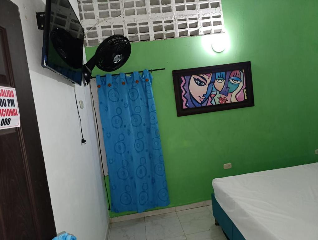 Postel nebo postele na pokoji v ubytování hotel villa palmera campestre