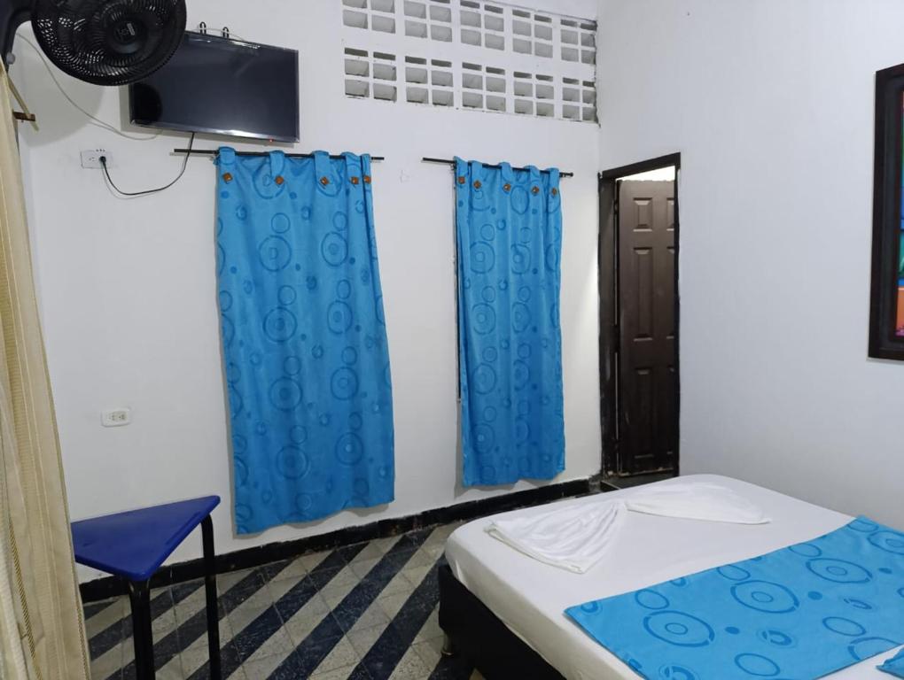 Postel nebo postele na pokoji v ubytování hotel villa palmera campestre