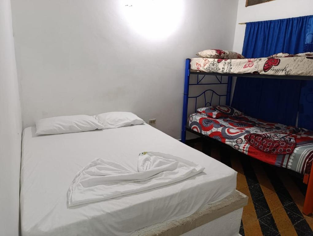 Postel nebo postele na pokoji v ubytování hotel villa palmera campestre