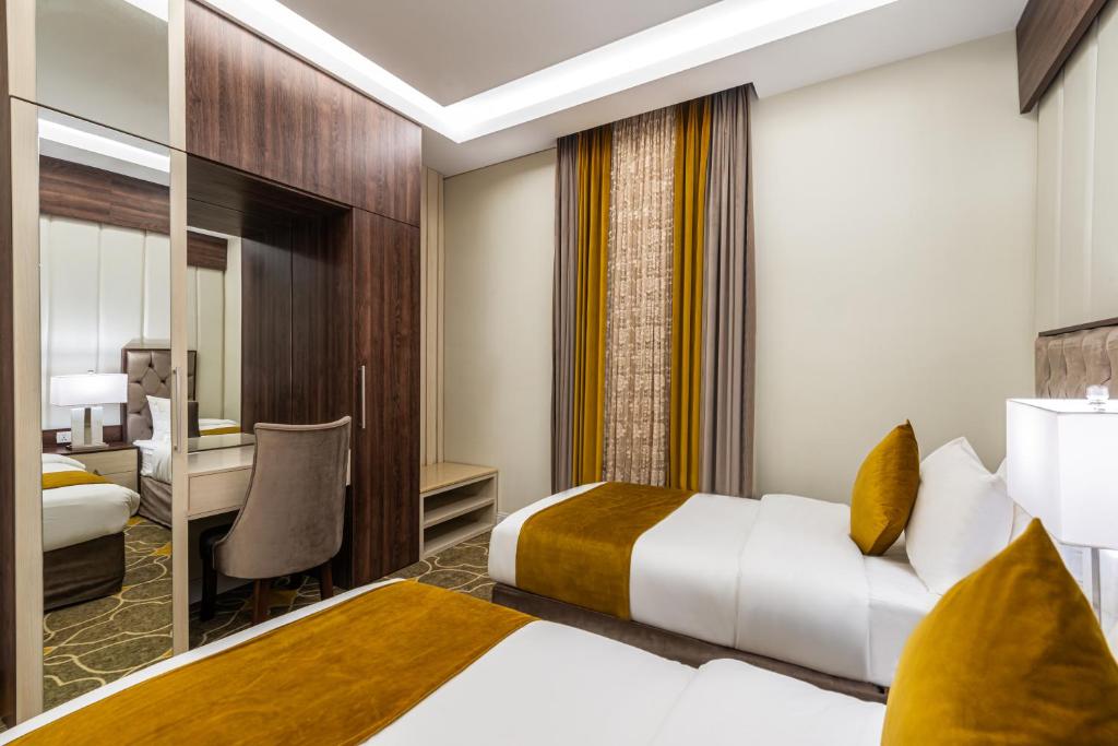 Postel nebo postele na pokoji v ubytování Garden Millennium Hotel