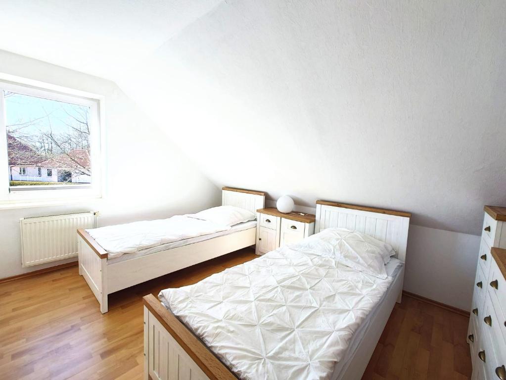Postel nebo postele na pokoji v ubytování Ferienhaus Pfauenblick