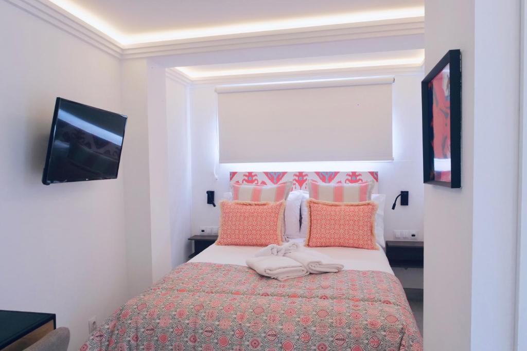 Ένα ή περισσότερα κρεβάτια σε δωμάτιο στο Golden Myra Apart-Hotel