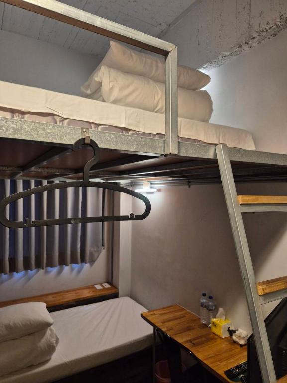 Postel nebo postele na pokoji v ubytování miniinn