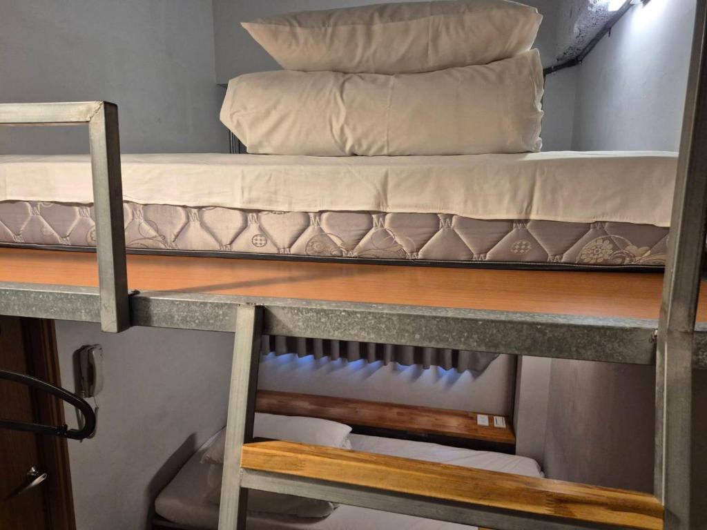Postel nebo postele na pokoji v ubytování miniinn