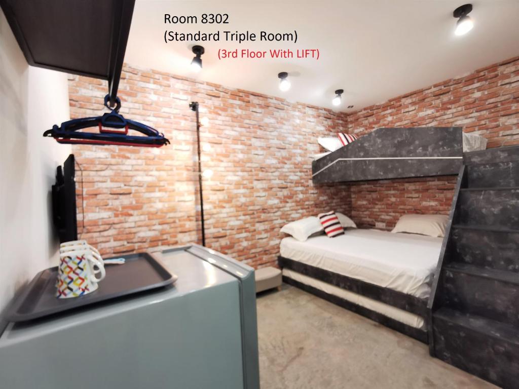Postel nebo postele na pokoji v ubytování Mwv Family Suite Room