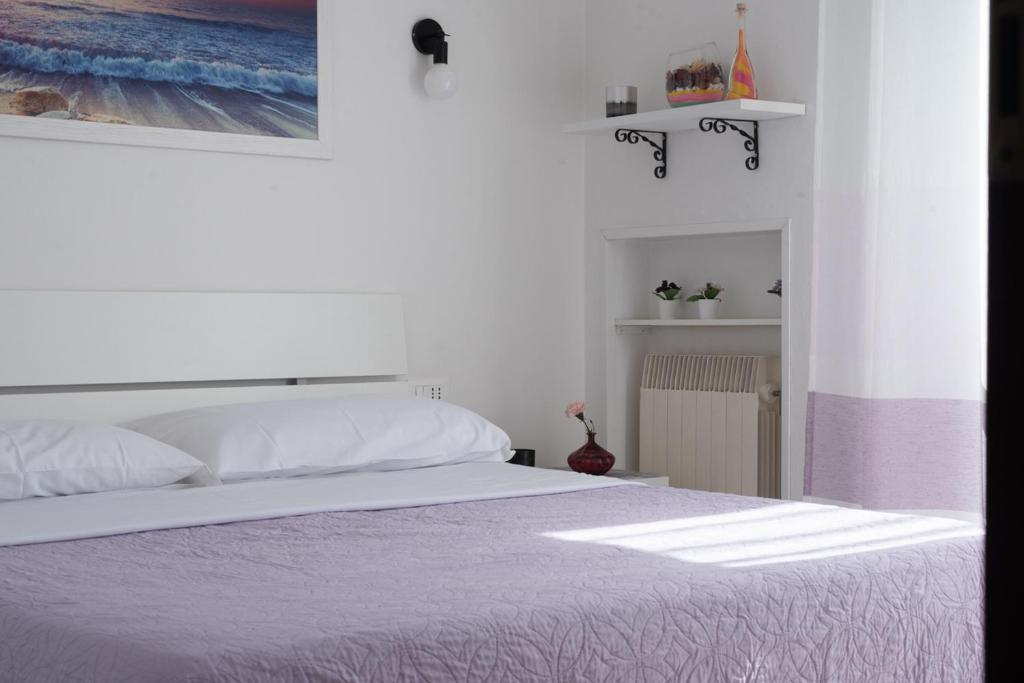 Postel nebo postele na pokoji v ubytování Viola lido adriano