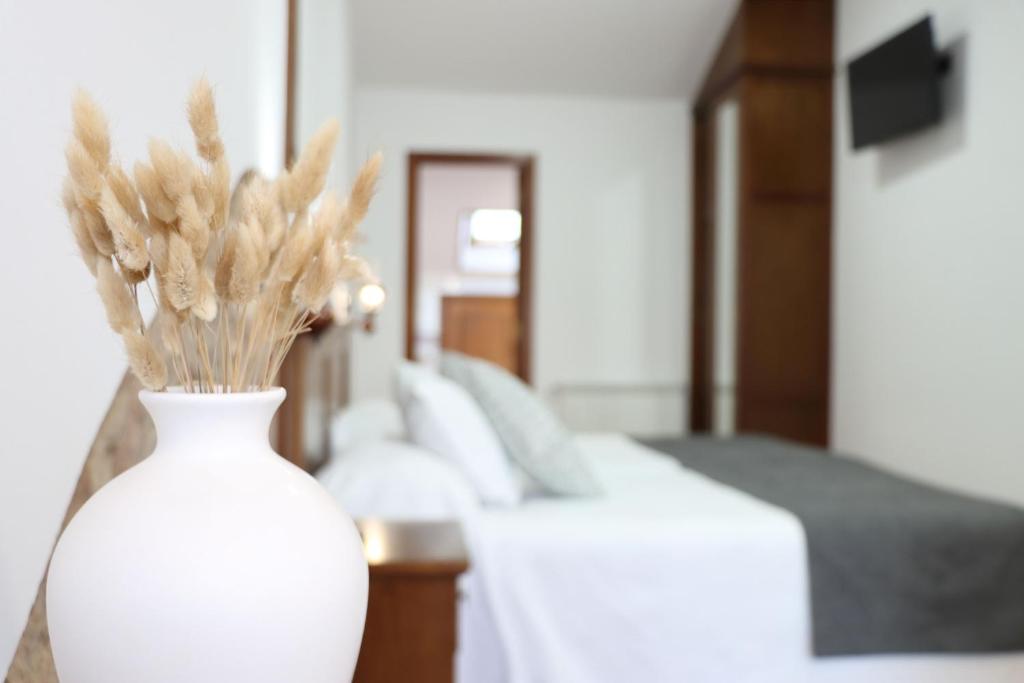Posteľ alebo postele v izbe v ubytovaní Hotel Pazos Alba