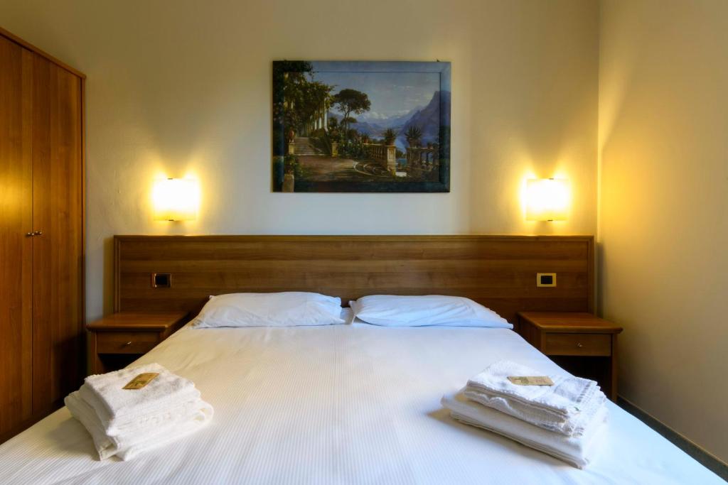 Postel nebo postele na pokoji v ubytování Hotel Ideale