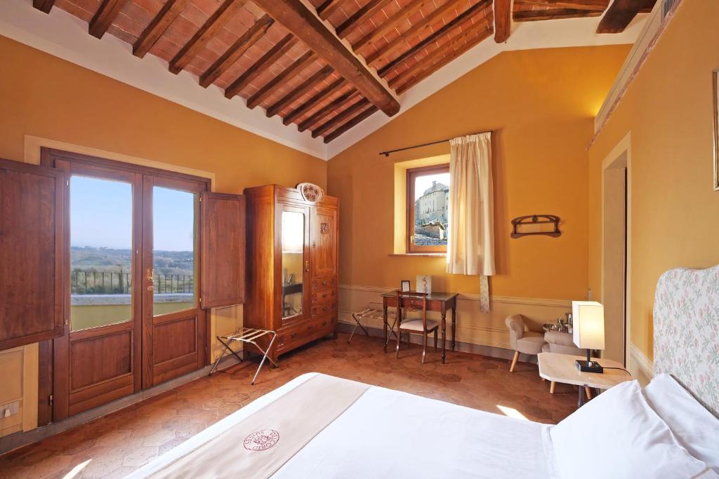 Postel nebo postele na pokoji v ubytování Delcorto Suites