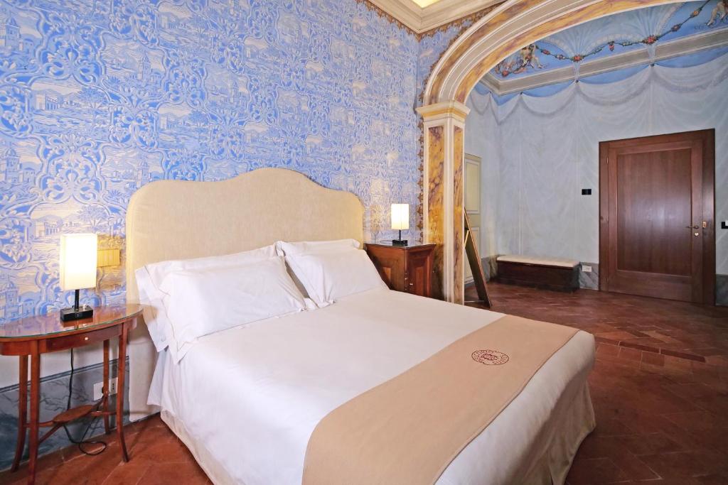 Postel nebo postele na pokoji v ubytování Delcorto Suites