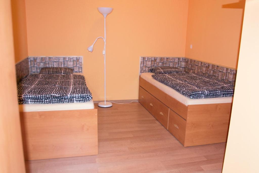 Postel nebo postele na pokoji v ubytování Penzion Veritas