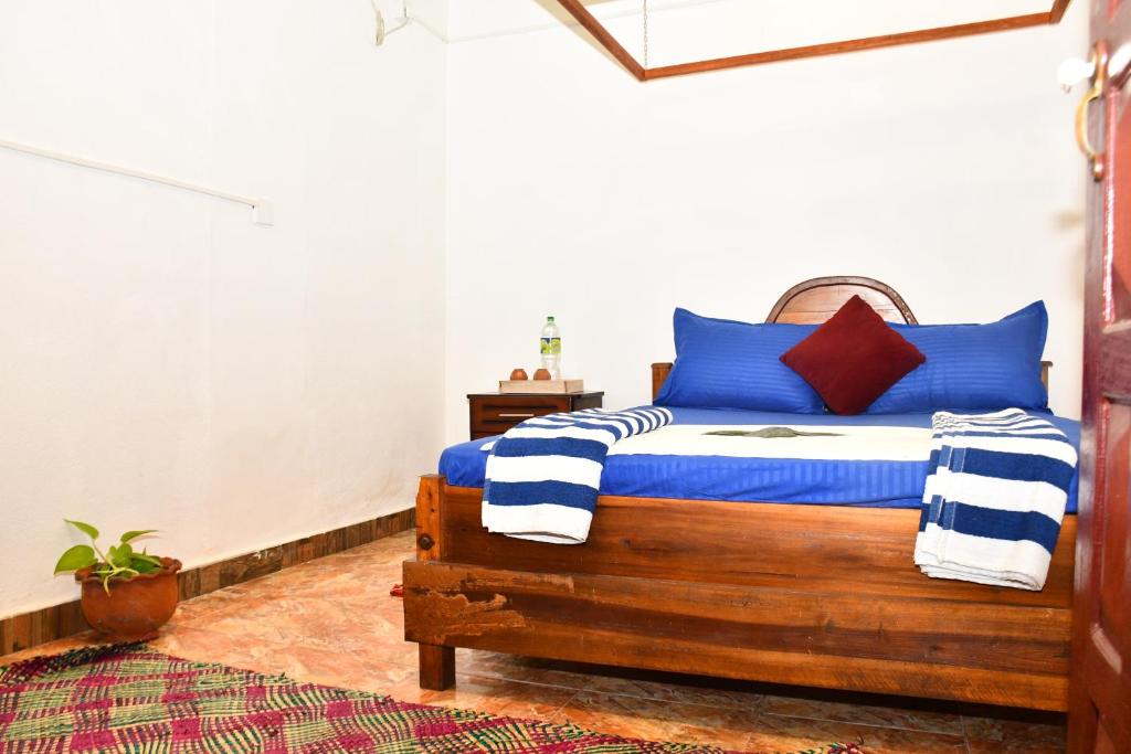Postel nebo postele na pokoji v ubytování Ulla Arugam Bay