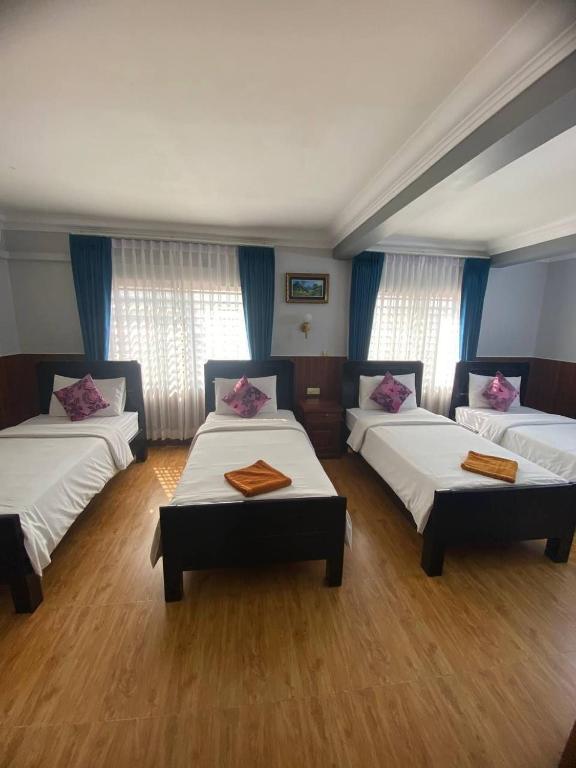 Postel nebo postele na pokoji v ubytování Jasmine Lodge Siem Reap