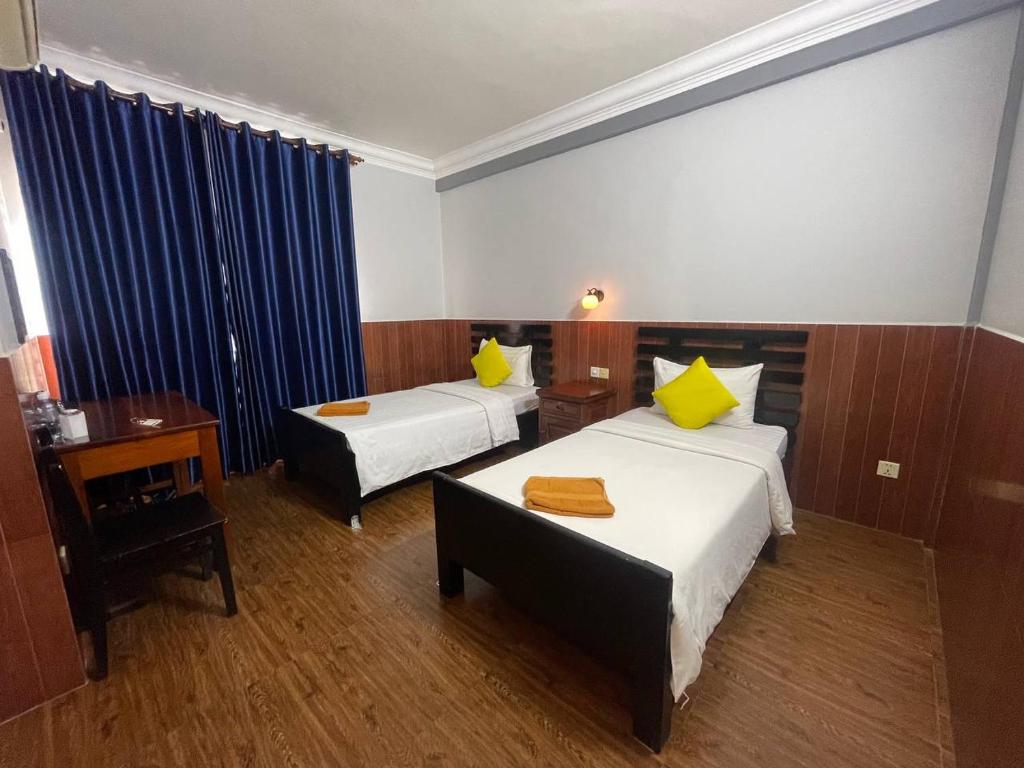 Postel nebo postele na pokoji v ubytování Jasmine Lodge Siem Reap