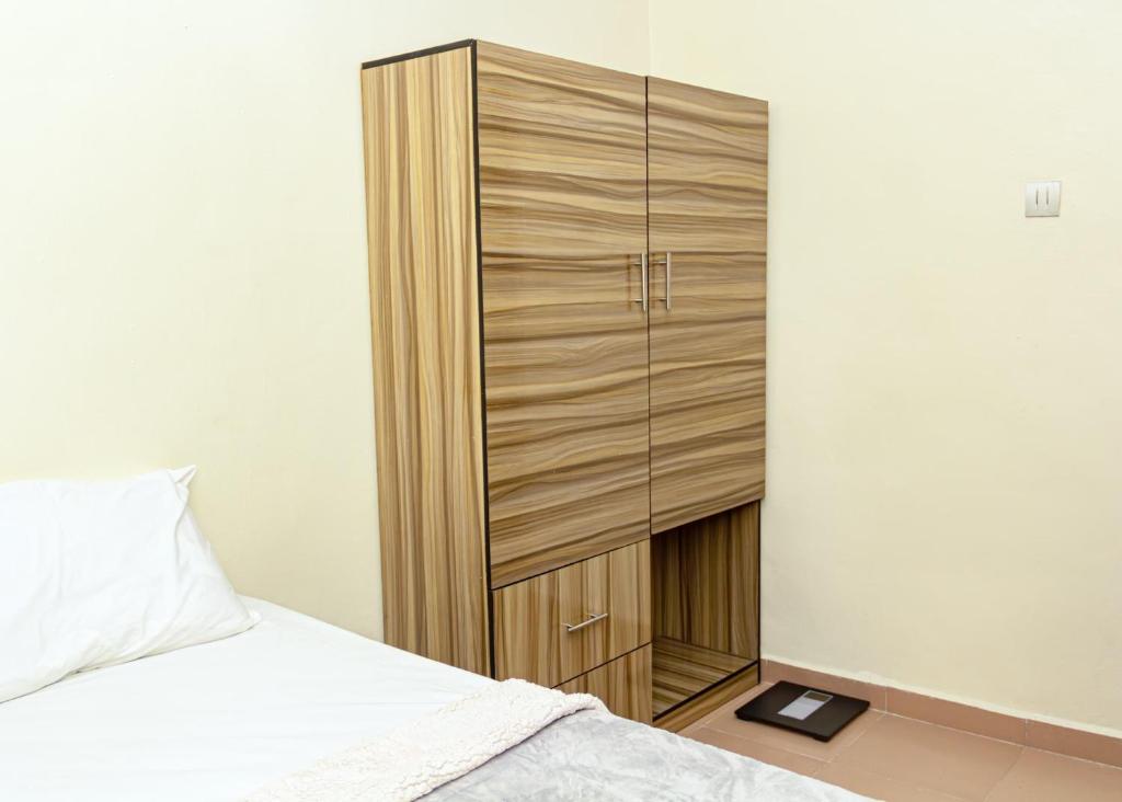 Postel nebo postele na pokoji v ubytování KGL Shortlet Apartment