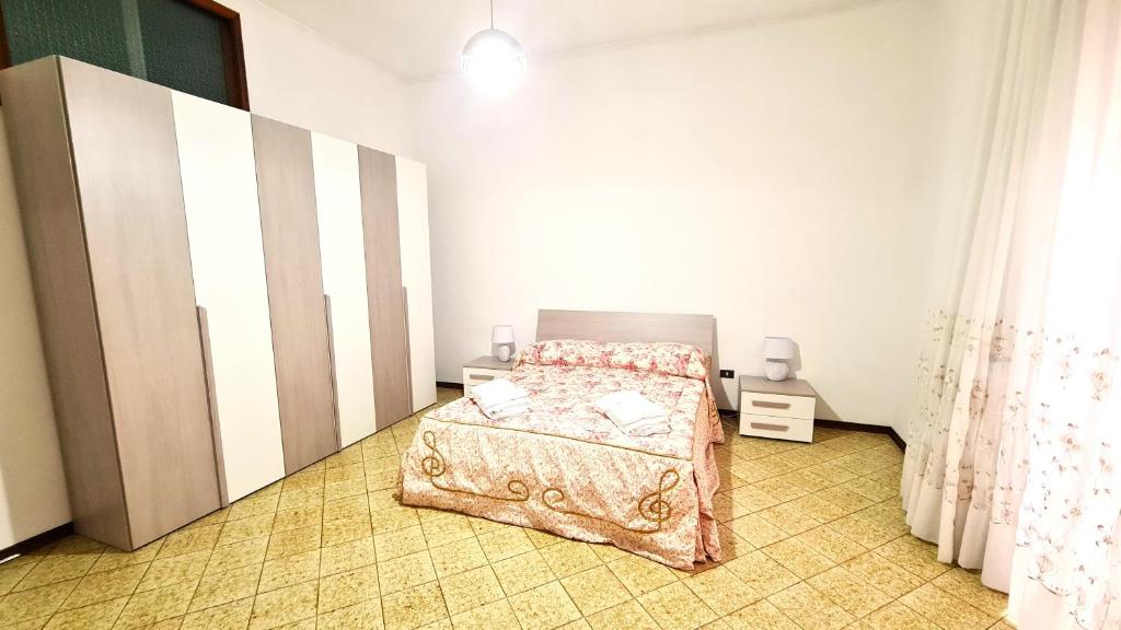 Postel nebo postele na pokoji v ubytování Casa Vacanze Nonna Tetta