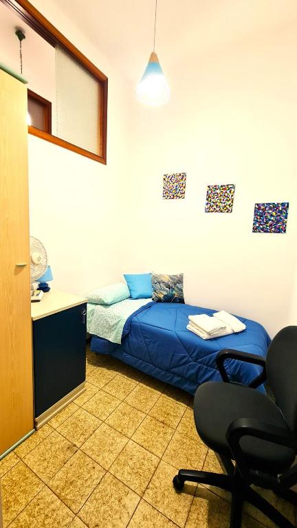 Postel nebo postele na pokoji v ubytování Casa Vacanze Nonna Tetta
