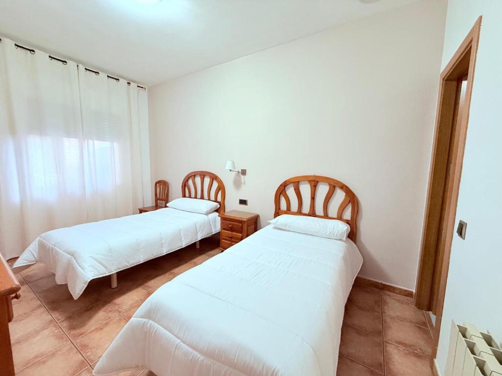 Postel nebo postele na pokoji v ubytování Hostal Castilla