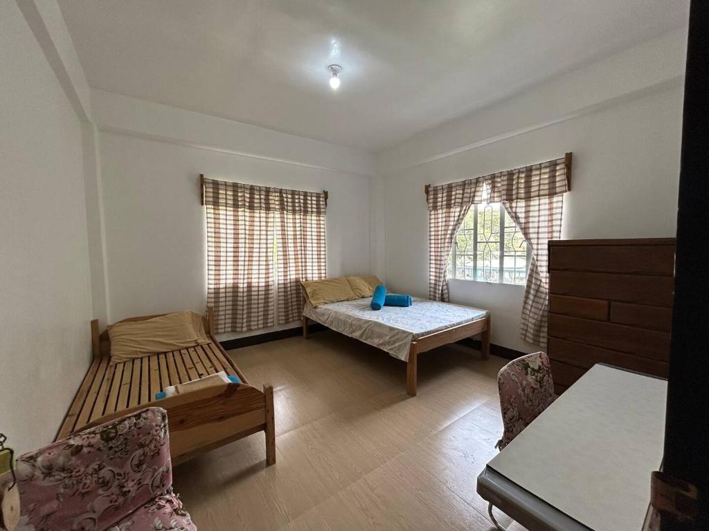 Postel nebo postele na pokoji v ubytování Ecowalk Homestay