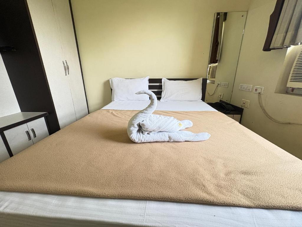 Postel nebo postele na pokoji v ubytování Hotel Benson Blue In Cuttack