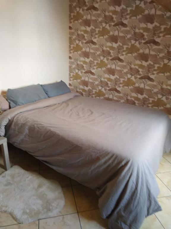 Postel nebo postele na pokoji v ubytování Maison Sérénité