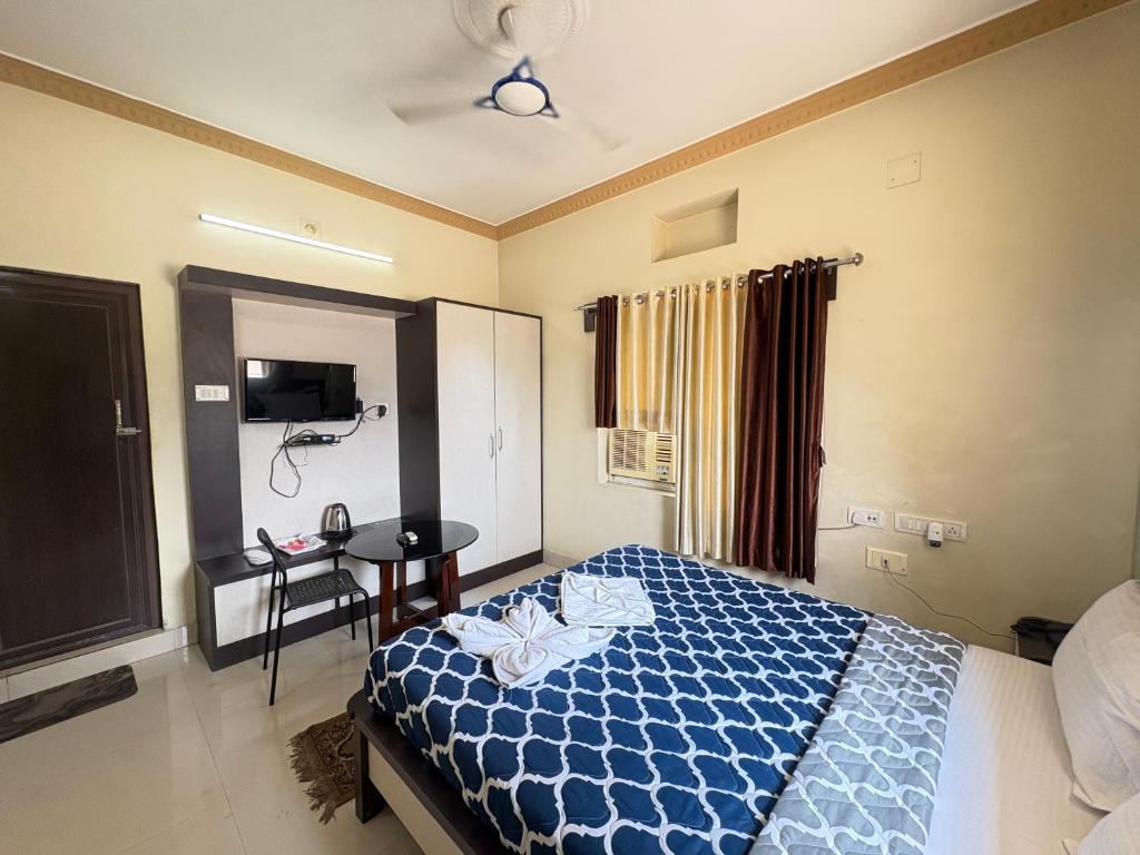 Postel nebo postele na pokoji v ubytování Hotel Benson Blue In Cuttack