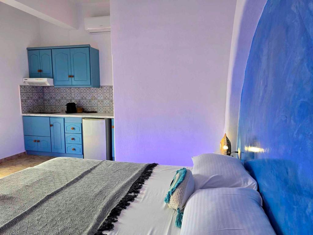 Postel nebo postele na pokoji v ubytování Papafotis Apartments & Suites