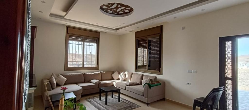 a living room with a couch and a table at Country House in Wadi Musa
