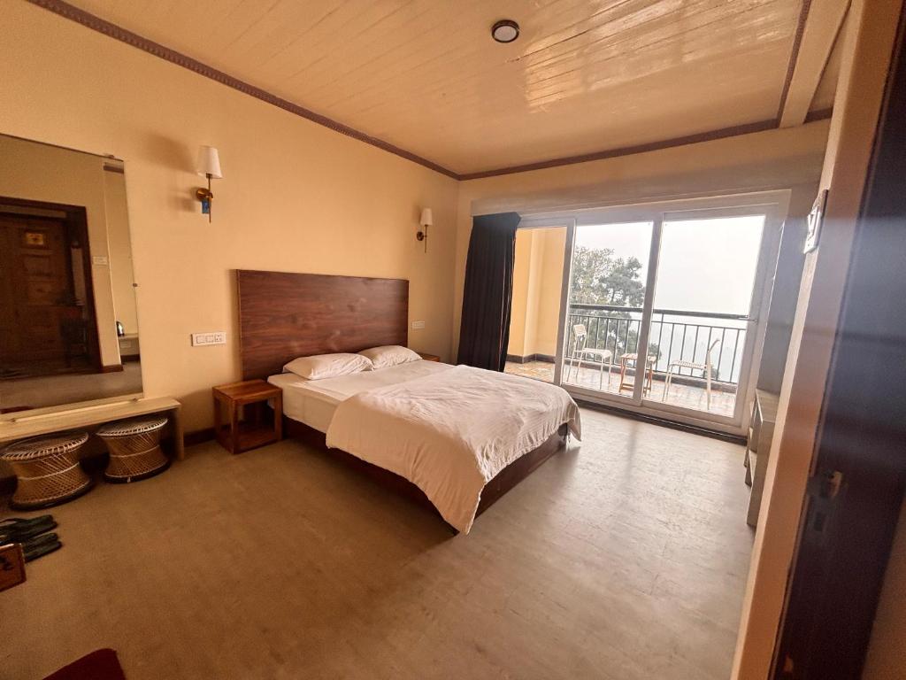 Postel nebo postele na pokoji v ubytování Asraya Homestay