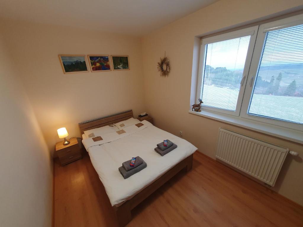 Postel nebo postele na pokoji v ubytování Apartmán Tymián